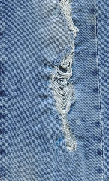 Vaqueros desgarrados textura de mezclilla. jeans vaqueros rasgados — Foto de Stock