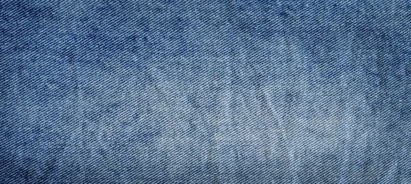Sydda textur denim jeans bakgrund. Denim jeanstyg — Stockfoto