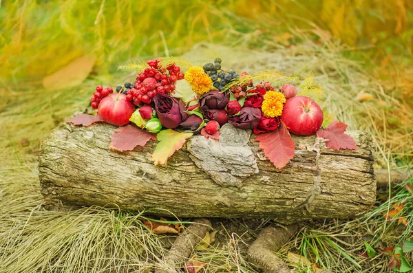 Autumn background with seasonal  berries, apples and flowers