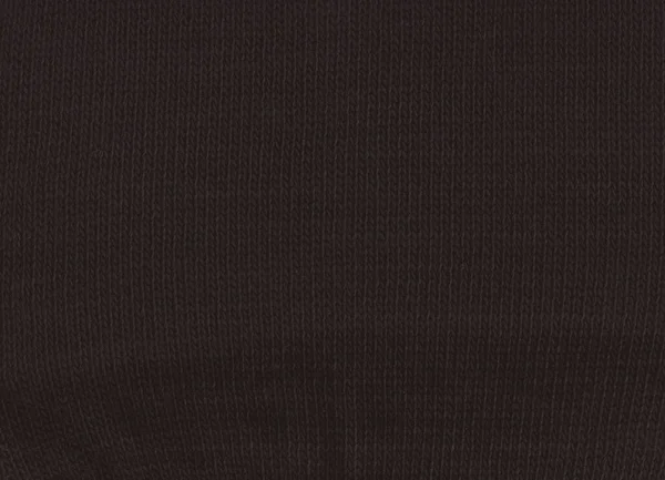 Teplý černý svetr z vlny. Černé textilie pozadí. — Stock fotografie