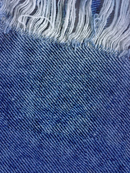 Azul denim jean textura de fondo. Vaqueros rasgados textura de la tela — Foto de Stock