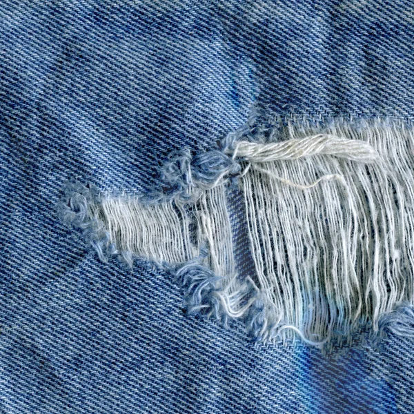 Синій джинсовий фон текстури джинсів. Джинси рвані текстури тканини — стокове фото