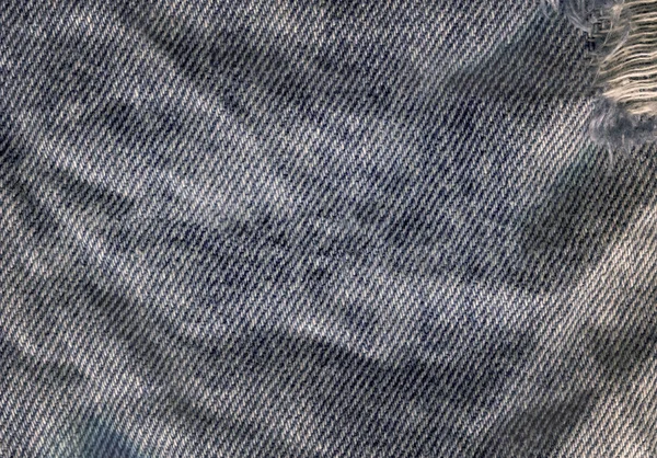 Texture of jeans textile close up. Jeans denim background