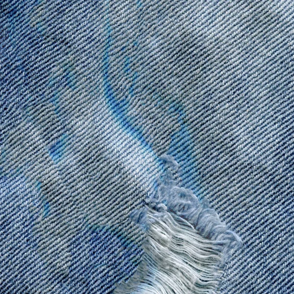 Azul denim jean textura de fondo. Vaqueros rasgados textura de la tela — Foto de Stock