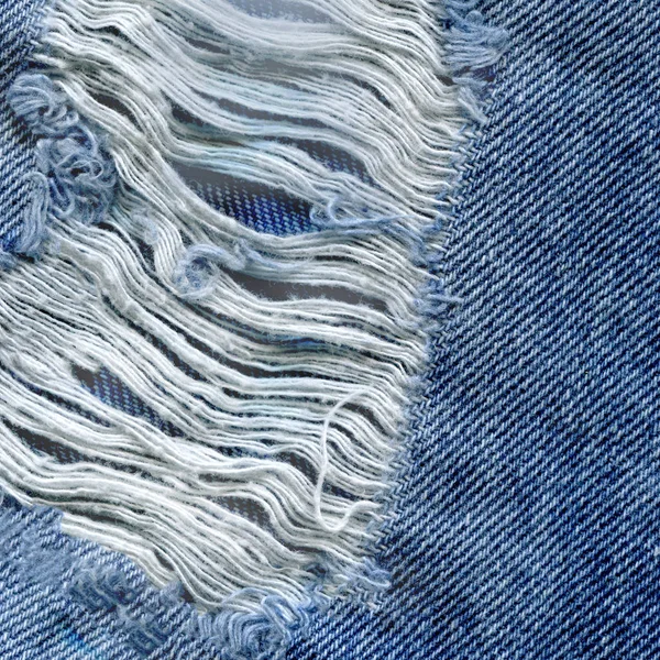 Modrá denim jean texturu pozadí. Džíny, roztrhané textilie textura — Stock fotografie