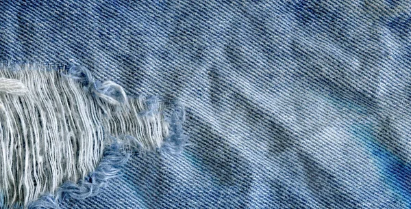 Blå denim jean textur bakgrund. Jeans sönderrivet tyg textur — Stockfoto