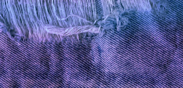 Blauw denim jean textuur achtergrond. Jeans gescheurd stof textuur — Stockfoto