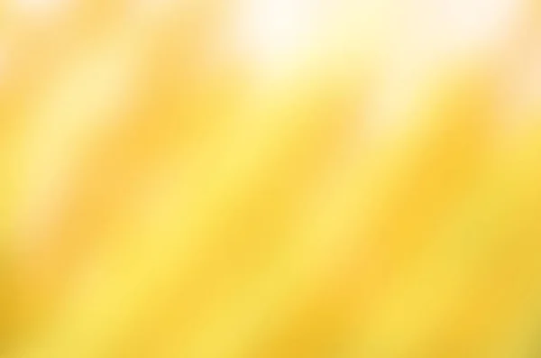 ゴールデン オレンジと黄色の抽象的なモーションぼかしの背景. — ストック写真