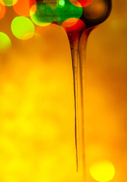 Honey stick with pouring honey. Honey flows from dipper. — ストック写真