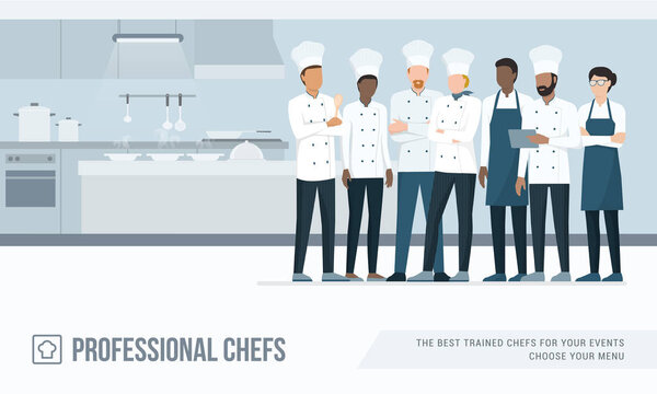 Professional chefs standing together in the restaurant's kitchen