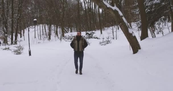Young Handsome Walks Winter Park — Stock Video