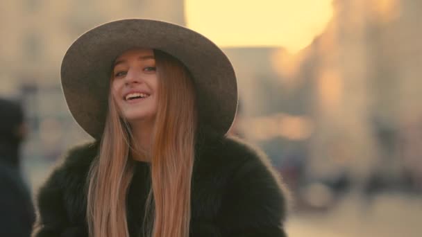 True emotions Close up of a young shy female face smiling happily towards the camera — Stock Video