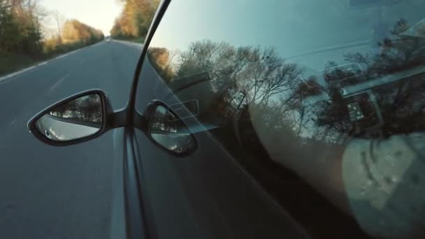 Driving at Sunset on the freeway. Hand on steering wheel — Stock Video