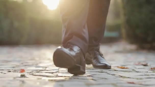 Closeup of luxury shoes, businessman walking, elegant rich person. Man in black shoes stepping forward Person moving forward outdoor. — Stock Video