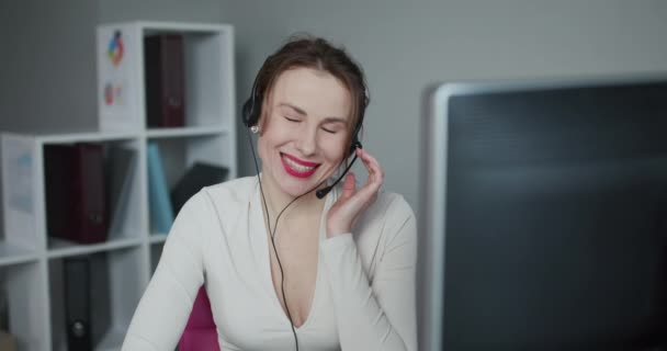 Young Beautiful Women Call Center Wear Headset and Working with Computer while Consulting Customer with Online Problem. Support and Operator Service Business Representative Concept. — 비디오