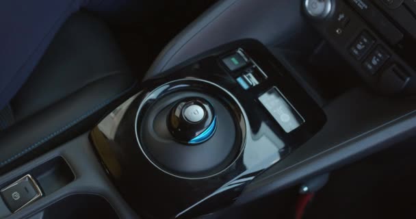 Pushes the parking brake button. Electric car parking shifter. Button Of Car Parking. The driver in the car presses the auto parking button. Smart technology. — Stock Video