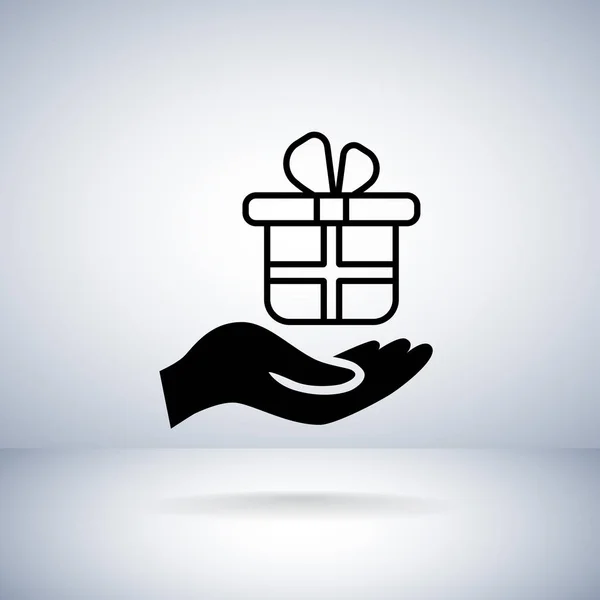 Gift box in hand icon — Stock Vector