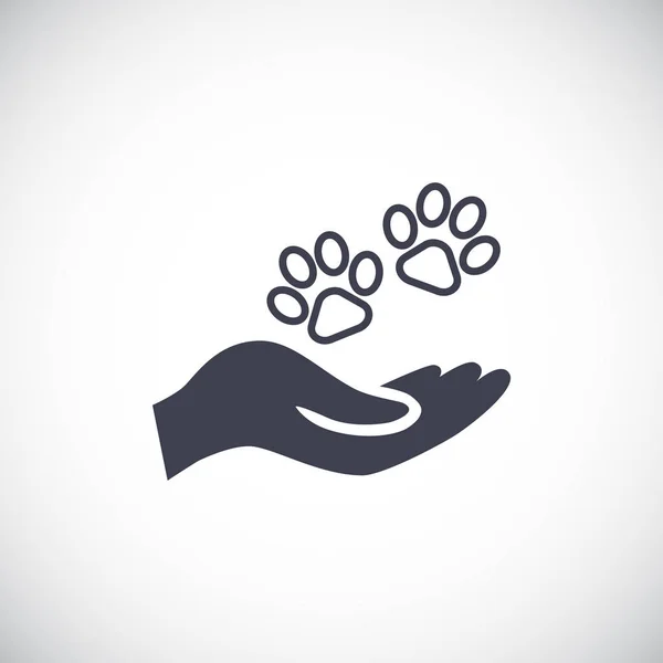 Mano con animal pata icono — Vector de stock