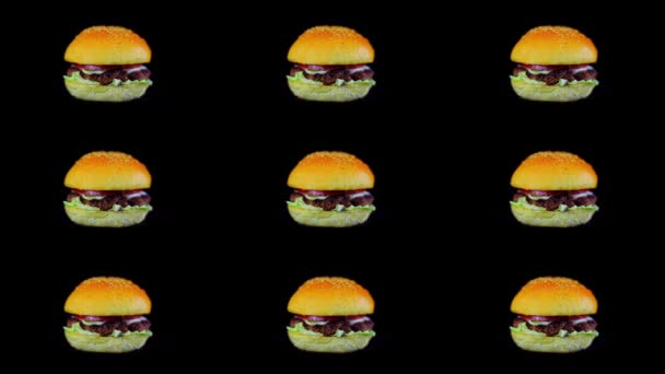 Sada devíti rotující hamburgery na černém pozadí izolované