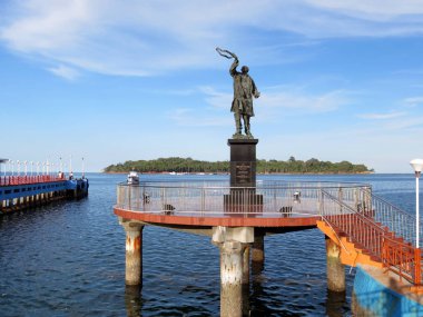 Statue of Rajiv Gandhi and Ross Island in background clipart