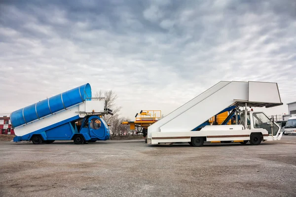 Passenger boarding steps vehicles in the parking airport machinery