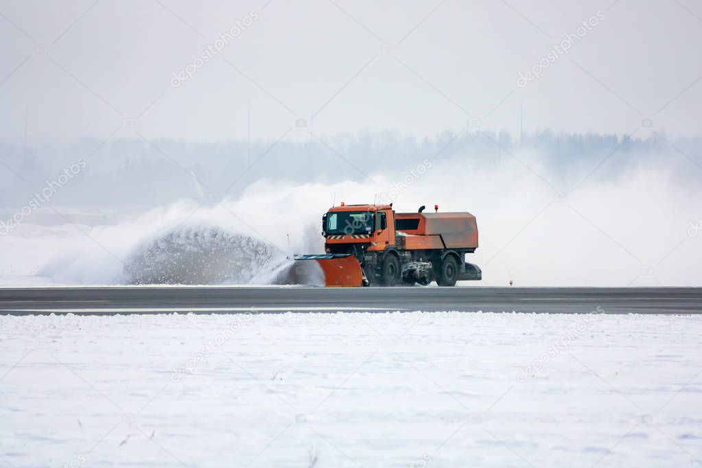 Snow-removal machine cleans the runway at the airport