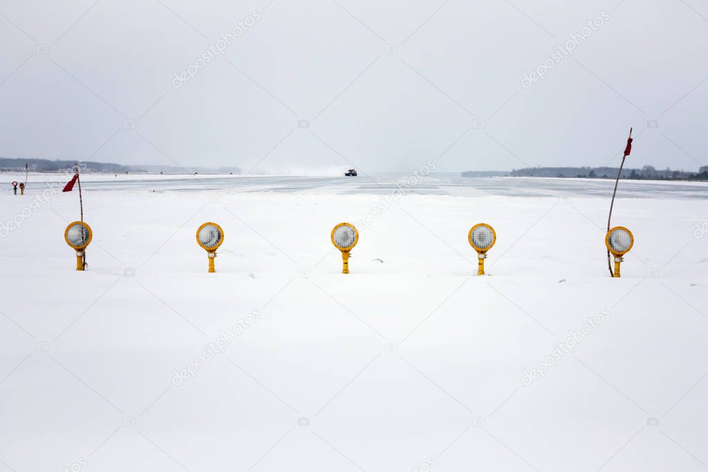 Approach lights of the winter airport runway