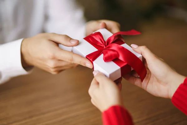Man Gives His Woman Gift Box Red Ribbon Hands Man — Stock Photo, Image