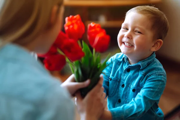 Little Son Congratulates Mother Gives Bouquet Flowers Tulips Happy Mother — Stock Photo, Image