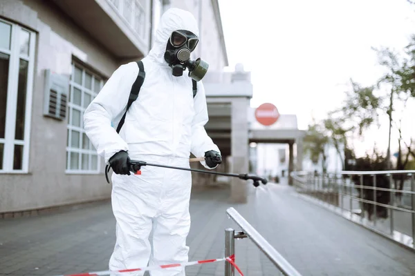 Man Protective Suit Mask Sprays Disinfector Railing Empty Public Place — Stock Photo, Image