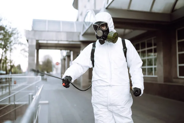 Man Protective Suit Mask Sprays Disinfector Railing Empty Public Place — Stock Photo, Image