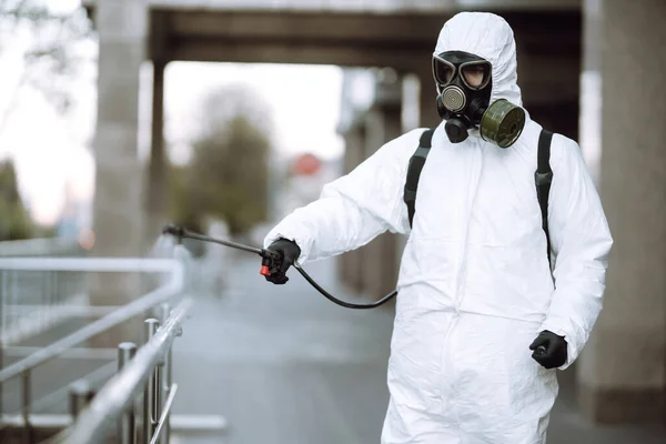 Man Protective Suit Mask Sprays Disinfector Railing Empty Public Place — Stock Photo, Image