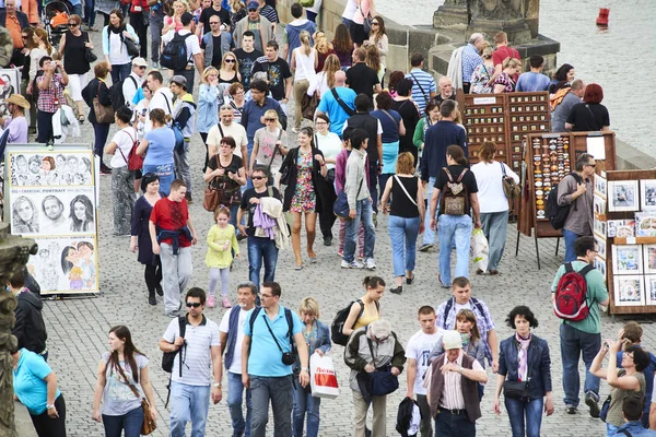 Charles Bridge in Prague, walking tourist, people pedestrians 