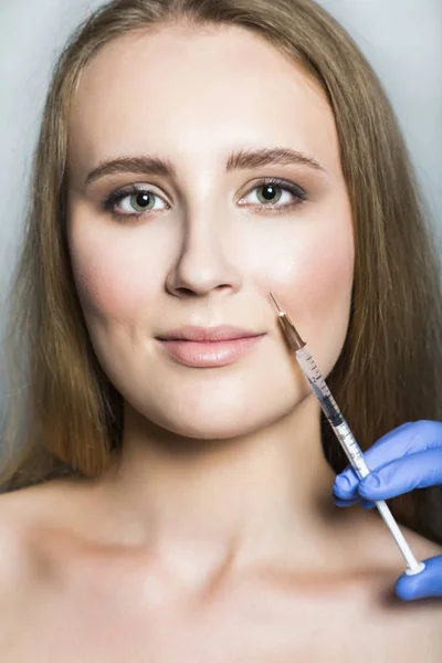 Doctor aesthetician makes face beauty injections to female patient — Stock Photo, Image