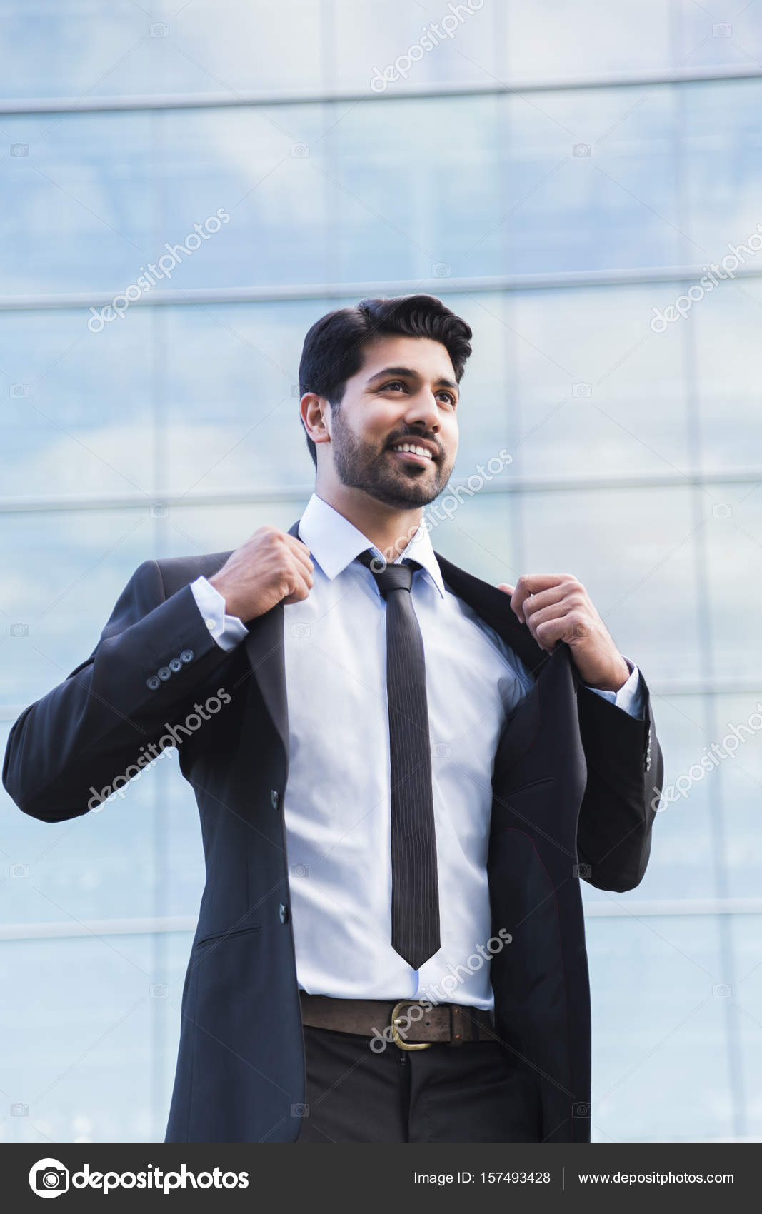 Successful businessman or worker standing in suit and