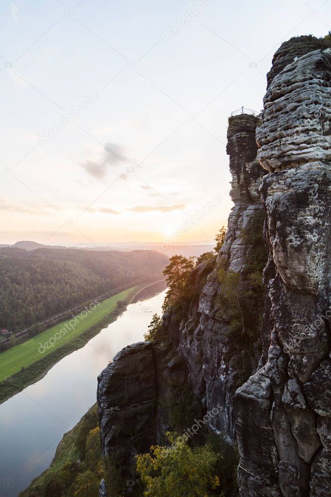 View from high mountain to narrow river in the forest