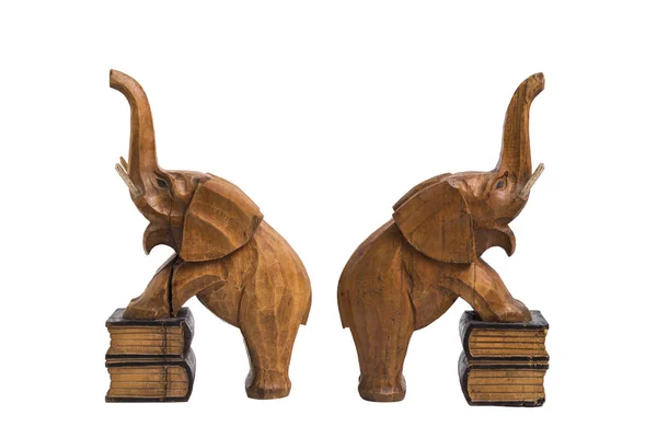 Two vintage old wooden carved brown elephants holders with raised trunks — Stock Photo, Image