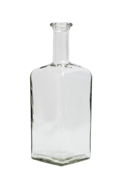Glass transparent empty simple square bottle on isolated background. Royalty Free Stock Photos