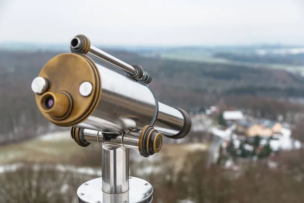 Binocular on observation deck on hill in winter