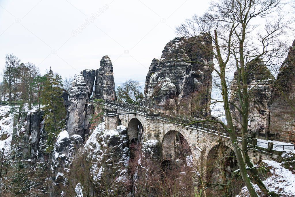 Bastei Bridge with snow rocks formations around