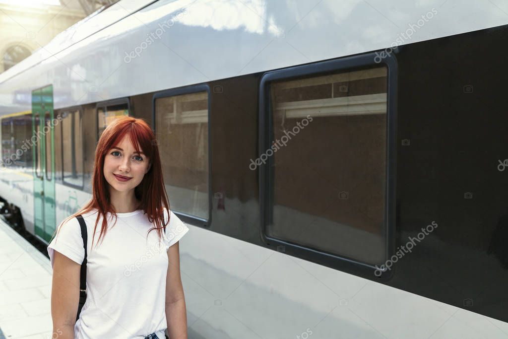 Close up portrait of girl on background of train