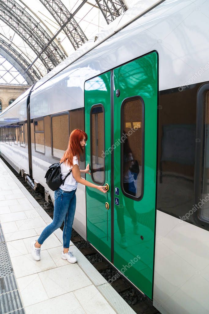 Girl runs on platform to door of departing train