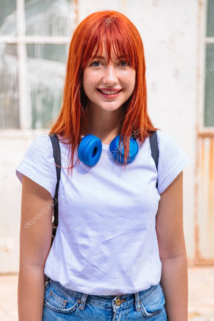 Close up portrait of girl with large headphones