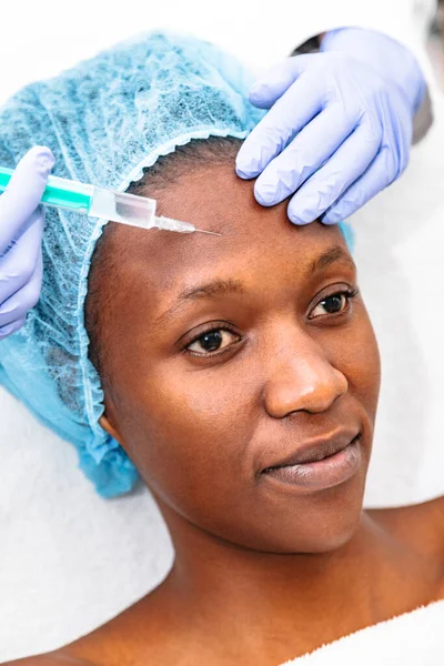 Young woman patient receiving plastic surgery injection — Stock Photo, Image