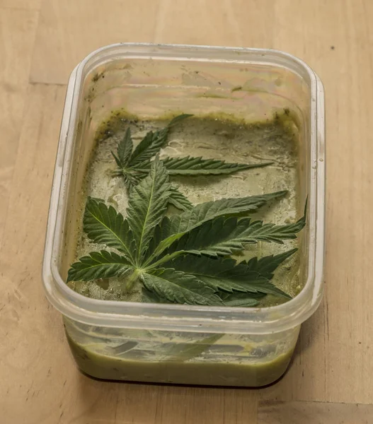 Marijuana green butter after finishing cooking — Stock Photo, Image