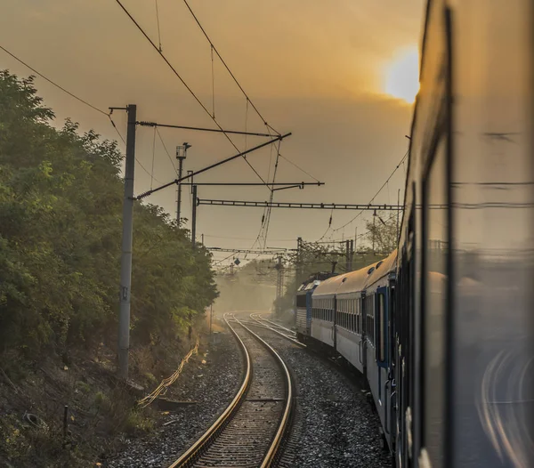 Fast train from Prague to south of Bohemia with sunrise — Stock Photo, Image
