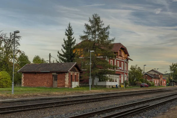 Old red building of Besiny station with railway in autumn evening — Stock Photo, Image