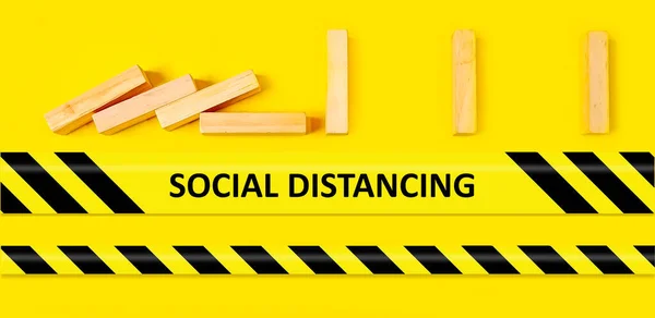 Social Distancing concept - bricks spaced apart so they don't fall showing social distancing