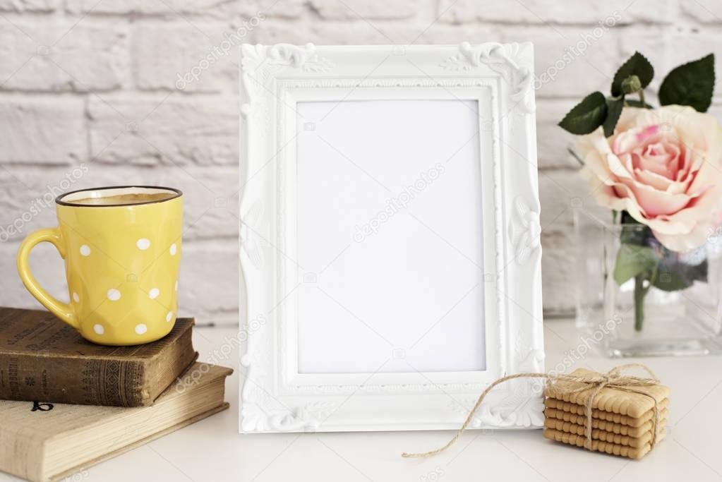Frame Mockup. White Frame Mock Up. Yellow Cup Of Coffee With White Dots, Cappuccino, Latte, Old Books, Cookies. Vase with Flower Rose, Styled Stock Photography. Empty Rustic Frame. Gray Brick Wall. Le