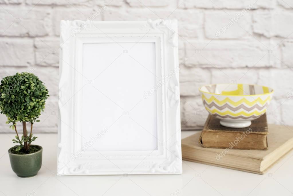 Frame Mockup. White Frame mockup. Styled Stock Photography. Old books, Bonsai Plant. Template Product Mock-up. Gray brick wall. Leisure lifestyle concept. Light rustic background 